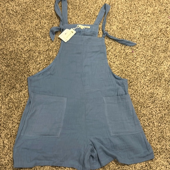 Lotus & Luna Sleeveless
Romper with Pockets - Picture 1 of 4